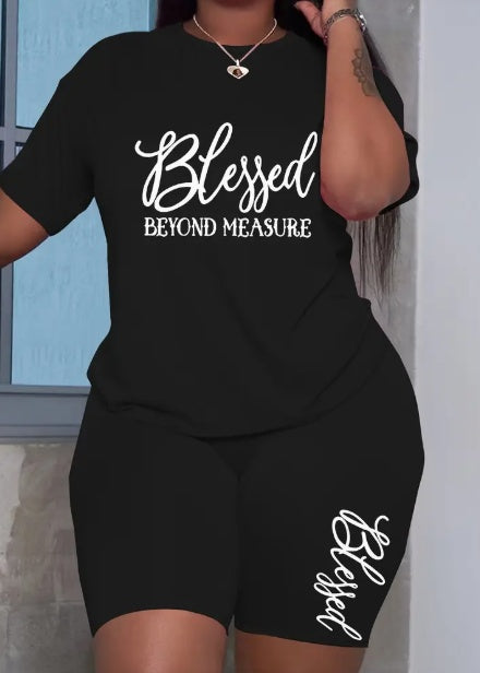Person wearing a black outfit with 'Blessed Beyond Measure' text.