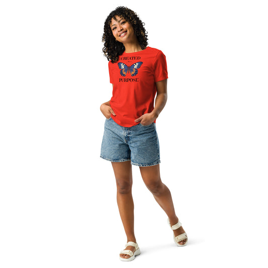 Person wearing a red t-shirt with a butterfly graphic and Created for a Purpose text,
