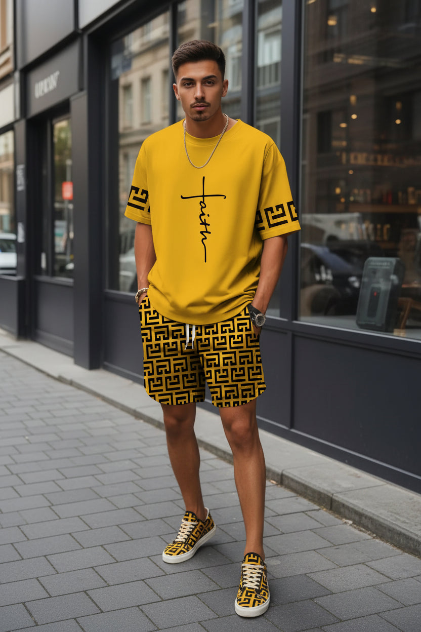 Person wearing a yellow 'Faith' t-shirt and black patterned shorts on a city street.