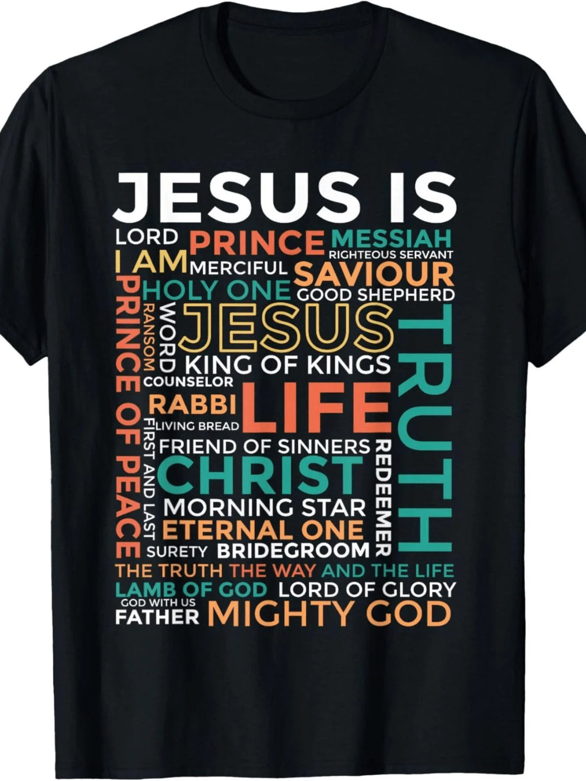 A black short-sleeve t-shirt with a colorful text graphic on the front reading 'JESUS IS' surrounded by various religious and spiritual phrases in white, orange, and teal.