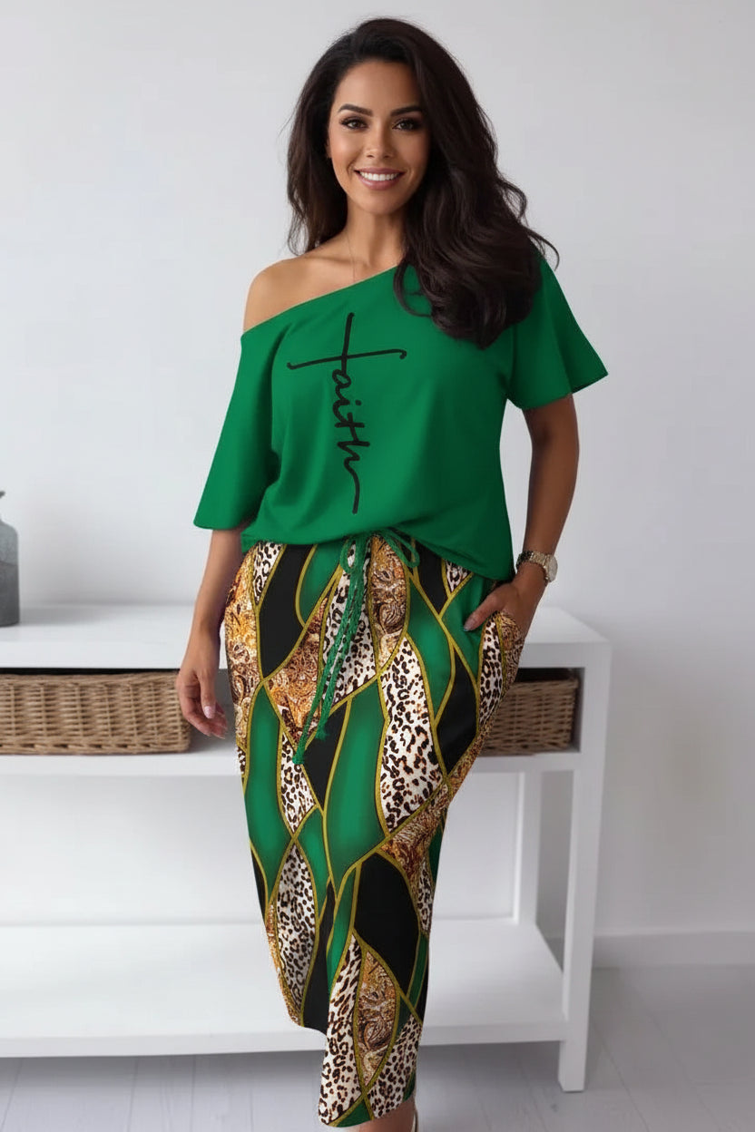 Person wearing a green off-shoulder top with 'Faith' printed on it and patterned pants.