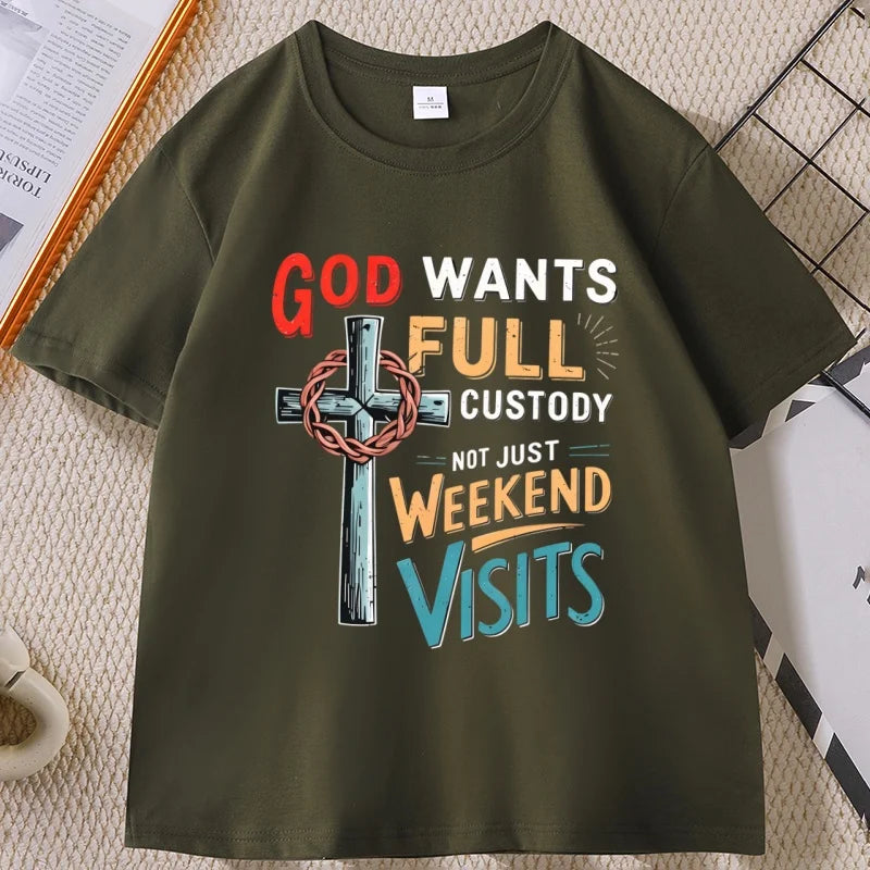 An olive green short-sleeve t-shirt with a colorful graphic print on the front. The graphic features a cross with a crown of thorns and the text 'GOD WANTS FULL CUSTODY NOT JUST WEEKEND VISITS' in red, white, orange, and blue lettering.