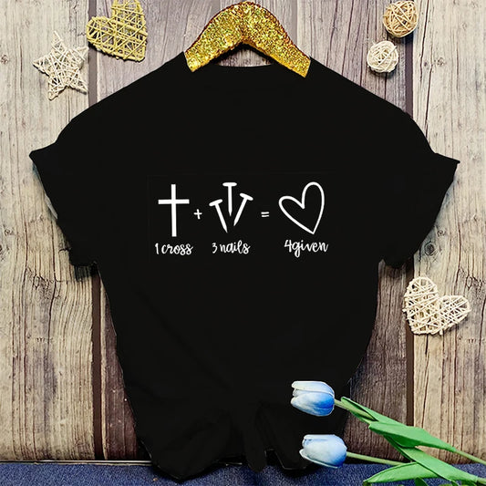 Black t-shirt with a mathematical equation design on a wooden surface with decorative elements.