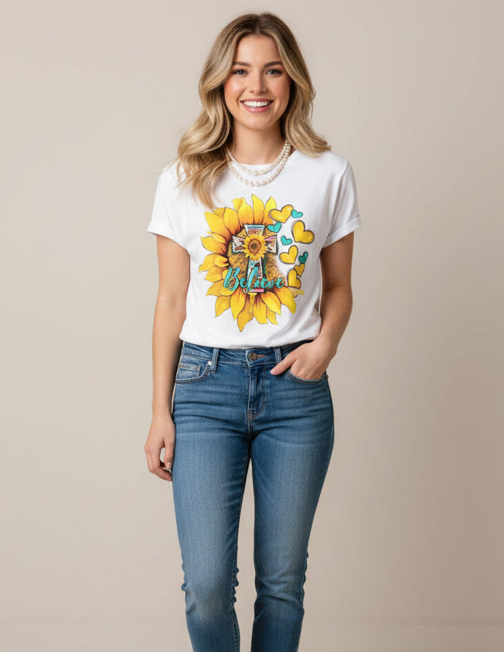 White t-shirt with a sunflower and heart design on a plain background