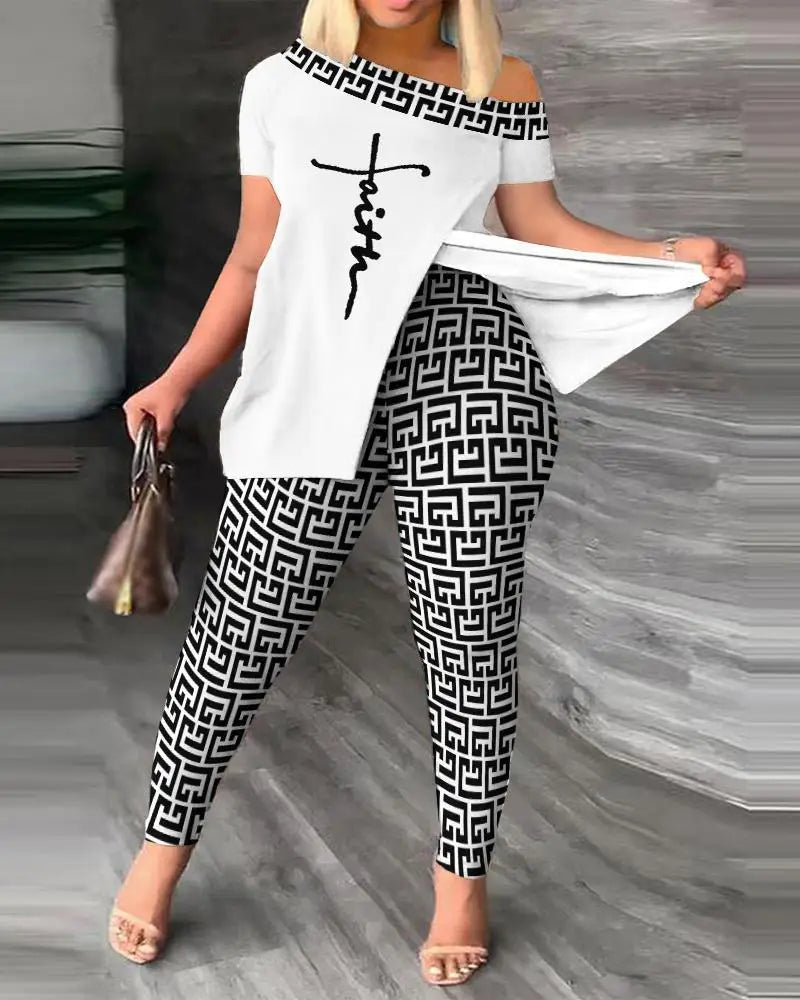 Woman wearing a white off-shoulder top with 'Faith' printed on it and black and white patterned pants.