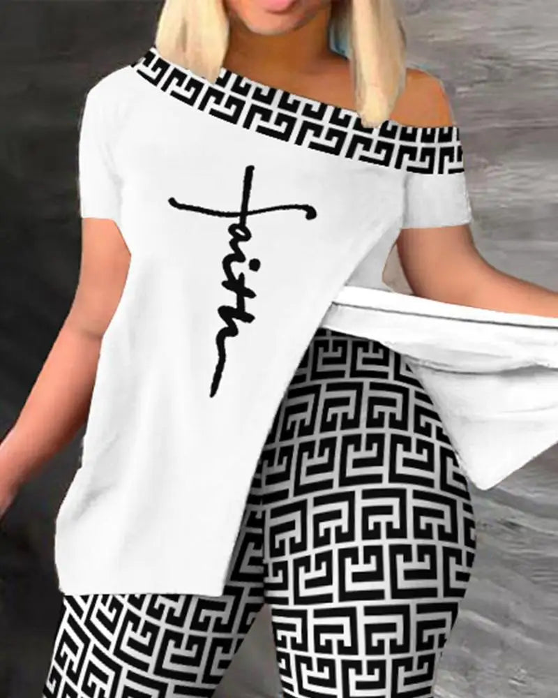 Person wearing a white off-shoulder top with 'faith' printed on it and black and white geometric patterned pants.