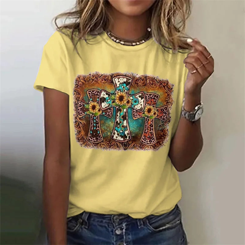 Person wearing a yellow t-shirt with a colorful cross design