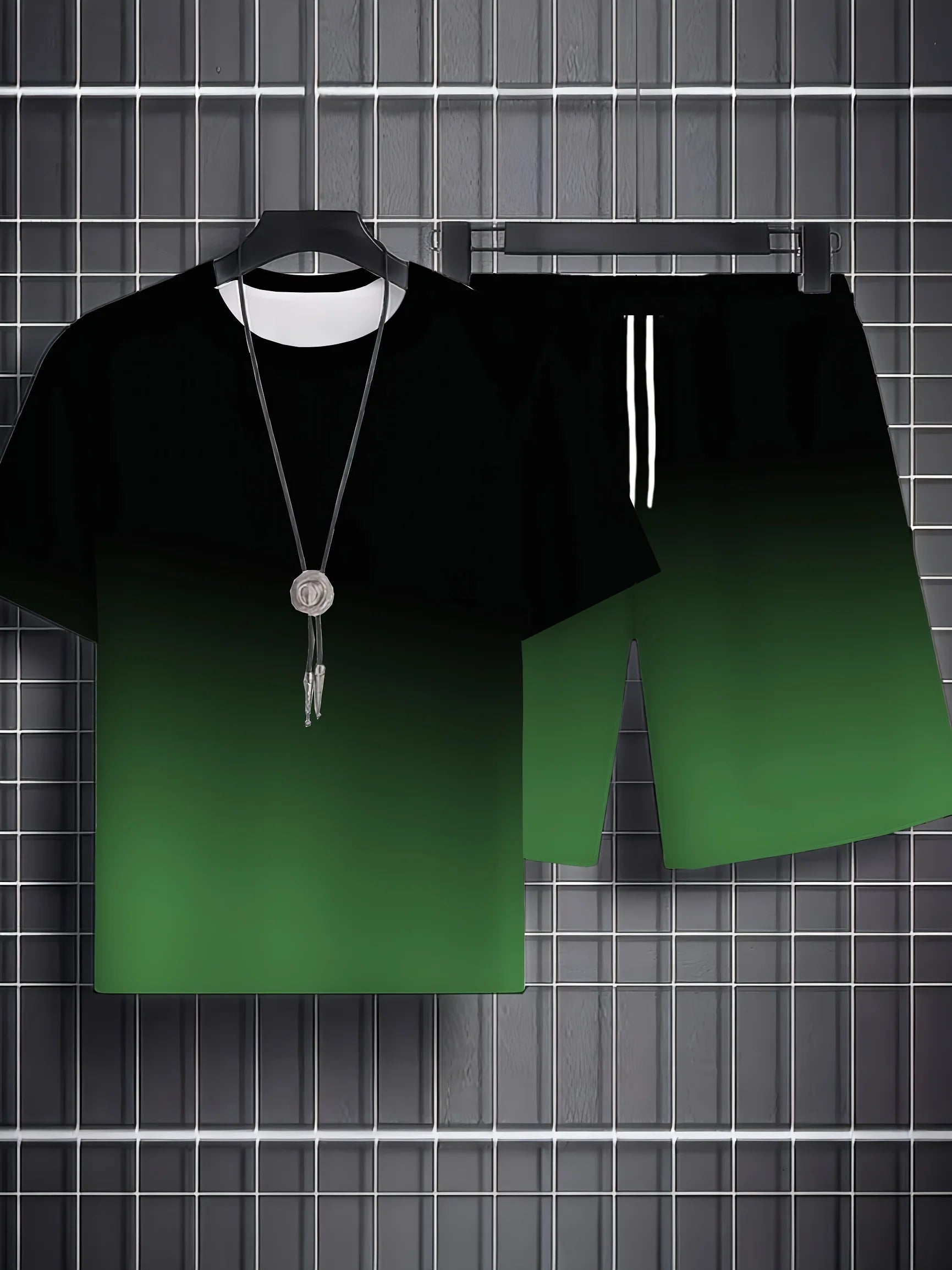 Black t-shirt with a green gradient design on a hanger against a grid background