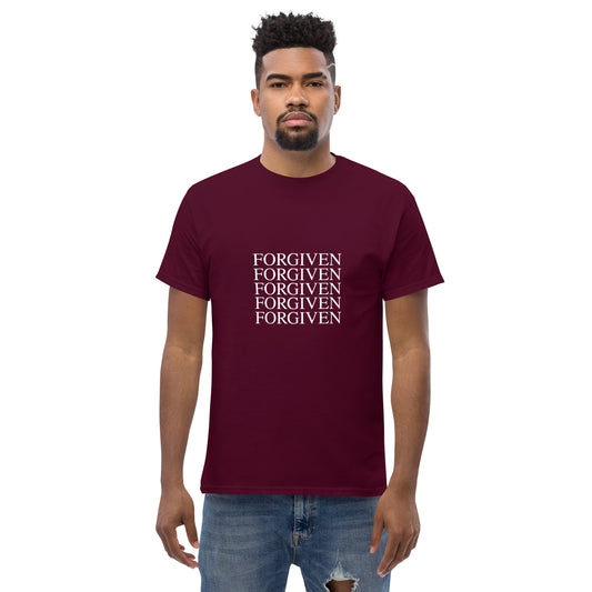 Man wearing a maroon t-shirt with 'FORGIVEN' text 