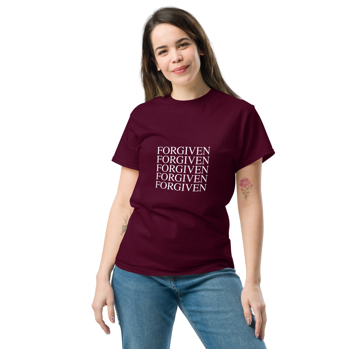 Woman wearing a maroon t-shirt with 'FORGIVEN' text on it.
